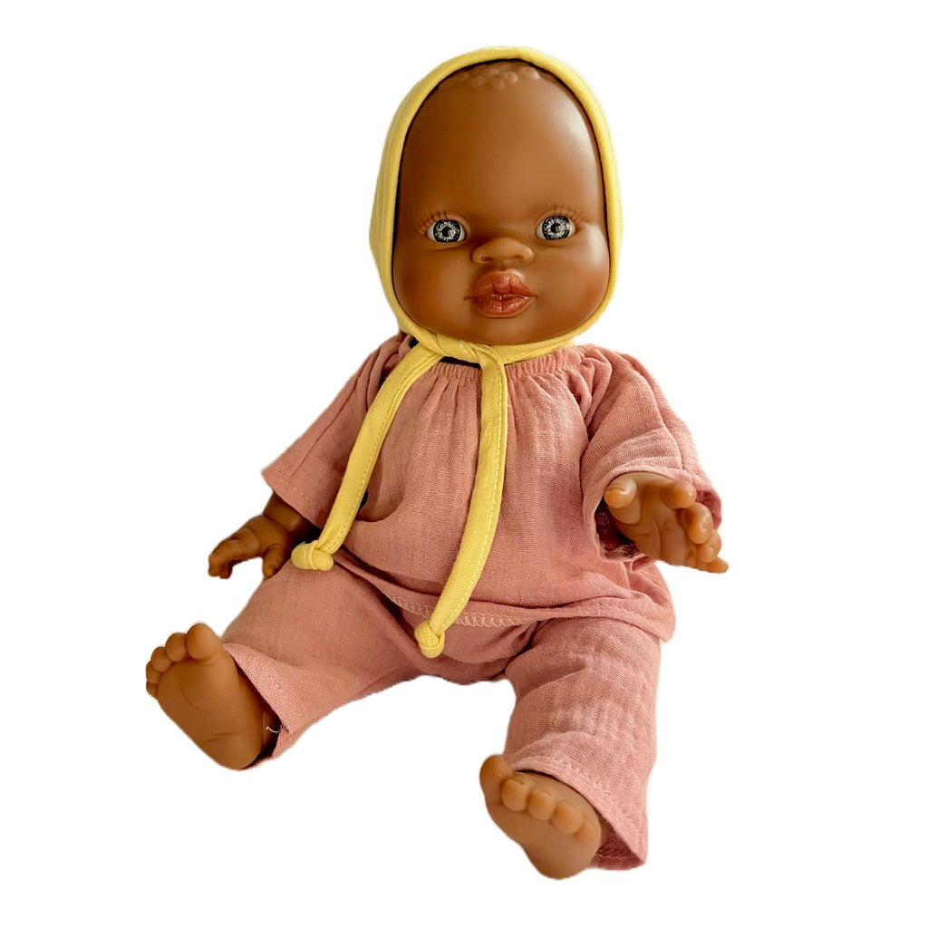 Minikane Bath Baby Doll in Pink Gauze Outfit and Yellow Bonnet · Brown