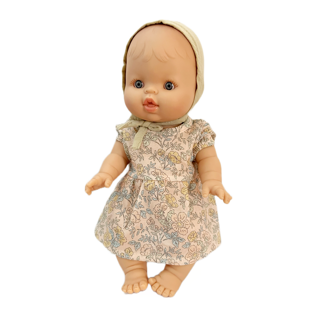 Minikane Bath Baby Girl Doll in Floral Dress and Khaki Bonnet · White