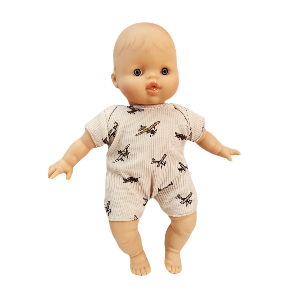 Minikane Soft Baby Boy Doll in Airplane Onesie  · White